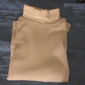 Light beige turtle neck by Lauren Scott